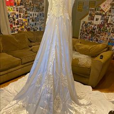 a wedding dress on display in a living room