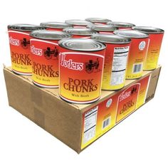 six cans of pork chunks sitting on top of a cardboard box