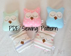 four stuffed owls sitting next to each other on top of a white sheet with the words pde sewing pattern