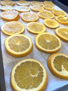 orange slices are arranged on a baking sheet