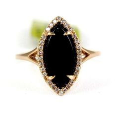 This Is A Fancy Marquise Cut Onyx & Diamond Lady's Ring. It Is Made Of 100% Natural 14kt Rose Gold And Is In Brand New Condition. It Has A Ctw Of 2.05ct (0.15 Diamond/1.90 Onyx) And Weighs 2.9 Grams. The Fancy Diamonds Have A Clarity Of Si1 And H Color. This Beautiful Custom Piece Has An Excellent Marquise Cut Onyx Stone, Surrounded By A Diamond Halo. Vintage Wedding Rings Black Diamond, Black Marquise Diamond Rings, Elegant Black Marquise Cut Diamond Ring, Black Marquise Diamond Jewelry, Black Marquise Engagement Ring, Onyx Rings, Nontraditional Engagement Rings, Black Onyx Engagement Ring, Black Wedding Rings