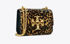 Introducing Tory Burch Eleanor. From the runways of 2020, the Tory Burch Eleanor Bag Collection was debuted. Included in the new Tory Burch Eleanor Collection: Tory Burch Eleanor Shoulder Bag; Tory Burch Eleanor Quilted Bag; Tory Burch Eleanor Leopard Bag; Tory Burch Eleanor Clutch; Tory Burch Eleanor Wallet; Tory Burch Eleanor Mini Crossbody;  Tory Burch Eleanor Belt; and the Tory Burch Eleanor Phone Card Pocket | Tory Burch Bag | Tory Burch Black Bag | Designer Handbags | Designer Bags | Tory Burch Eleanor Bag, Leopard Print Boots, Leopard Print Sneakers, Leopard Pumps, Leopard Boots