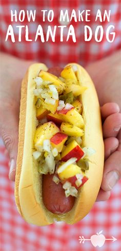 a person holding a hot dog with toppings on it and the words how to make an atlanta dog