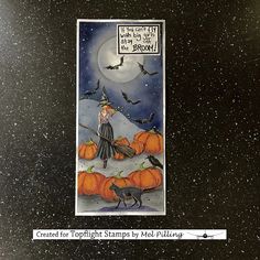 a halloween card with a witch and pumpkins