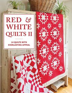 red and white quilts in front of a basket on top of a wooden crate