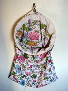 a floral purse hanging on the wall