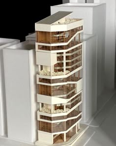 a model of a tall building with lots of windows