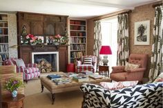 a living room filled with furniture and a fire place