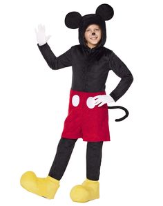 a young boy in mickey mouse costume standing with his hand up to the side and smiling