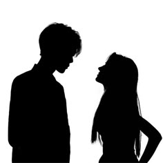 two people standing next to each other in silhouette