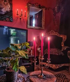 a living room filled with furniture and candles