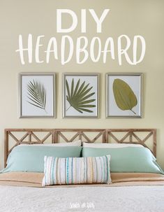 a bed with three framed pictures above it and the words diy headboard above it