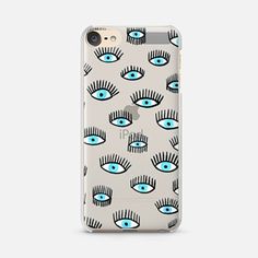 an iphone case with blue eyes and eyelashes on it, all over the phone cover