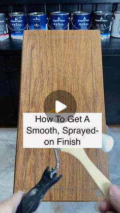 a person is using a toothbrush to clean a wooden plaque with the words how to get a smooth, spray - on finish