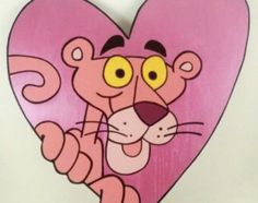 a pink heart with a cartoon cat on it