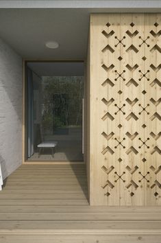 the interior of a house with wood flooring and white walls, along with an open door