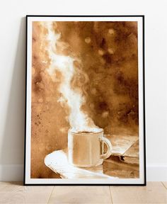 a coffee cup with steam rising out of it on a table next to a book