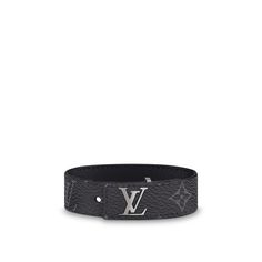 Slim and sleek, with an inlaid lv clasp that lies flush to the strap, this new masculine bracelet is offered in black calfskin, monogram or monogram eclipse coated canvas. All are calf-leather lined. Easy to wear, this signature piece makes a handsome little gift. Luxury Black Leather Engraved Bracelet, Luxury Black Engraved Leather Bracelet, Luxury Engraved Black Leather Bracelet, Luxury Black Cuff Bracelet, Luxury Engraved Leather Bracelet, Luxury Leather Bracelet, Leather Street Style, Mens Leather Accessories, Louis Vuitton Bracelet