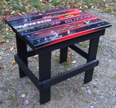 a small table made out of skateboards on the ground