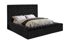 a bed with black upholstered headboard and foot board