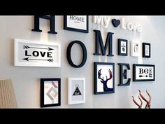 there are many pictures on the wall with letters and frames above them that say home