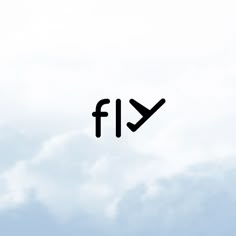 the word fly is written in black on a blue sky with white clouds behind it