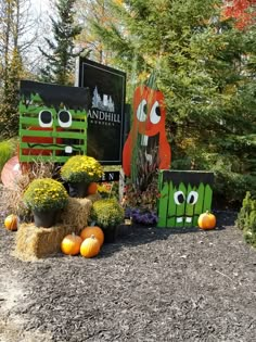 pumpkins and hay bales are sitting in the garden