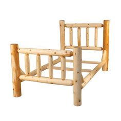 a wooden bed frame made out of logs