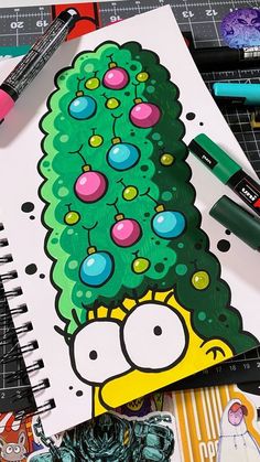 a drawing of a cartoon character with a christmas tree on it's head, surrounded by markers and pencils