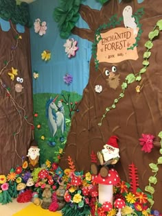 an image of a forest scene made out of paper flowers and trees with gnomes