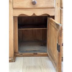 an old wooden cabinet with one drawer open