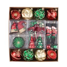 twelve christmas ornaments in an open box