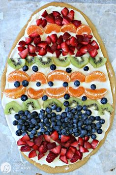 a cake with fruit on it and the words sugar cookie easter egg written in white