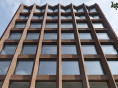 a tall brick building with lots of windows