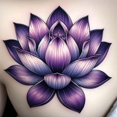 a woman's back with a purple flower tattoo on it