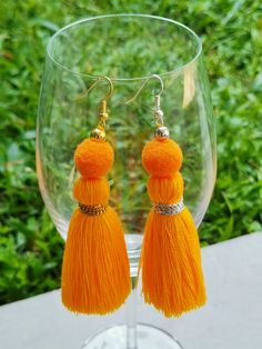 Tassel earrings in a variety of colors make a great gift! a perfect statement earring for those with sensitive ears! Weight: 0.08 ounce each Droplength: 4 Inches from the top of the earwire. These are handmade products. Made from threads and breads. lightweight. Colors may vary slightly due to screen settings. Orange Tassel Drop Earrings As Gift, Orange Tassel Drop Earrings, Orange Tassel Drop Earrings For Gift, Yellow Tassel Earrings For Festival, Bohemian Orange Tassel Earrings For Festivals, Bohemian Orange Fringe Earrings, Orange Fringe Tassel Earrings For Gift, Tassel Earrings As Festival Gifts, Tassel Earrings For Festivals And Gifts