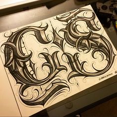 an inked piece of paper with the letter e on it