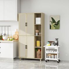 a kitchen with white cabinets and counter tops in the middle of the flooring area