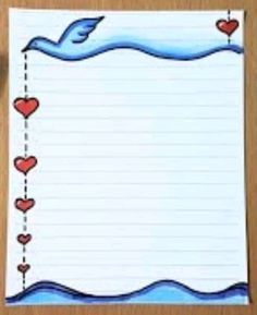 a piece of paper with hearts on it and a bird flying over the water in the background