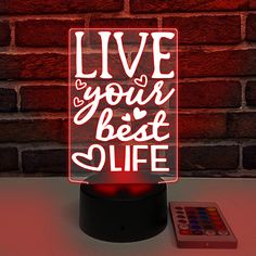 "Dorm Decor For College Girl, Desk Lamp, Acrylic Sign, Heart, Live Laugh Love, Cute Room, Preppy, Best Life Ever, Best friend Gift, Gamer Girl, Girls Room Decor, Night Light EDGE LIT ACRYLIC SIGN, LIVE YOUR BEST LIFE LED Base changes colors with different effects or can be single color using included remote. 3 AA Batteries NOT included. USB cable included but no plug adapter. Base is 3.5\" in Diameter by 1.5\" tall  Acrylic Sign with LED base measures 4.25\" width by 7.5\" height.  Thickness of Desk Lamp Cute, Y2k Desk Lamp, Cute Gold Desk Lamp, Cute Pink Lamp, Purple Desk Lamp, Girl Desk, Boulder City, Edge Lighting, College Girls