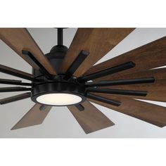 a ceiling fan with wooden blades hanging from it's center point and dark wood accents