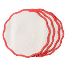 four red and white placemats on top of each other in the shape of a circle