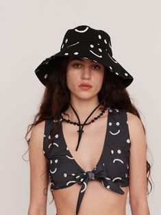 Wearing a bucket hat, not in a ‘cool chill guy’ way but in a ‘concerned about sun safety’ way. We love a bucket hat. This one is in our standard shape from a thick and durable cotton twill, with an extra wide brim and our signature Happy Sad print. It also has a cord with an adjustable pig toggle, so it won’t blow off your head when the wind picks up. Ballet Sneakers, Chill Guy, Sun Safety, Melissa Shoes, Women's Crocs, Wide Brimmed Hats, Tracksuit Bottoms, Brim Hat, Trouser Jeans