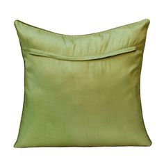 a green pillow on a white background