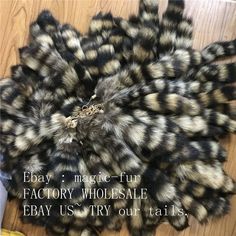 a pile of fake fur sitting on top of a wooden floor