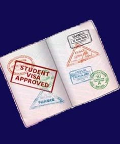 an open passport book with stamps on the front and back cover that says student visa approved