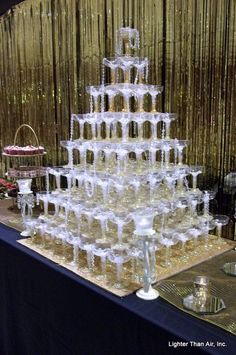 a very large cake made out of wine glasses