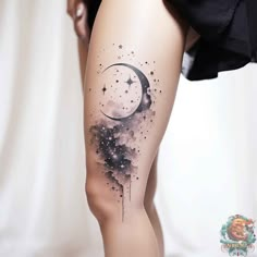 a woman's thigh with a crescent and stars tattoo on it