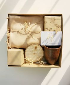 a gift box with wrapped presents and a card