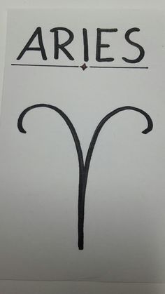 a piece of paper with the word aries written on it and an arrow drawn in black ink